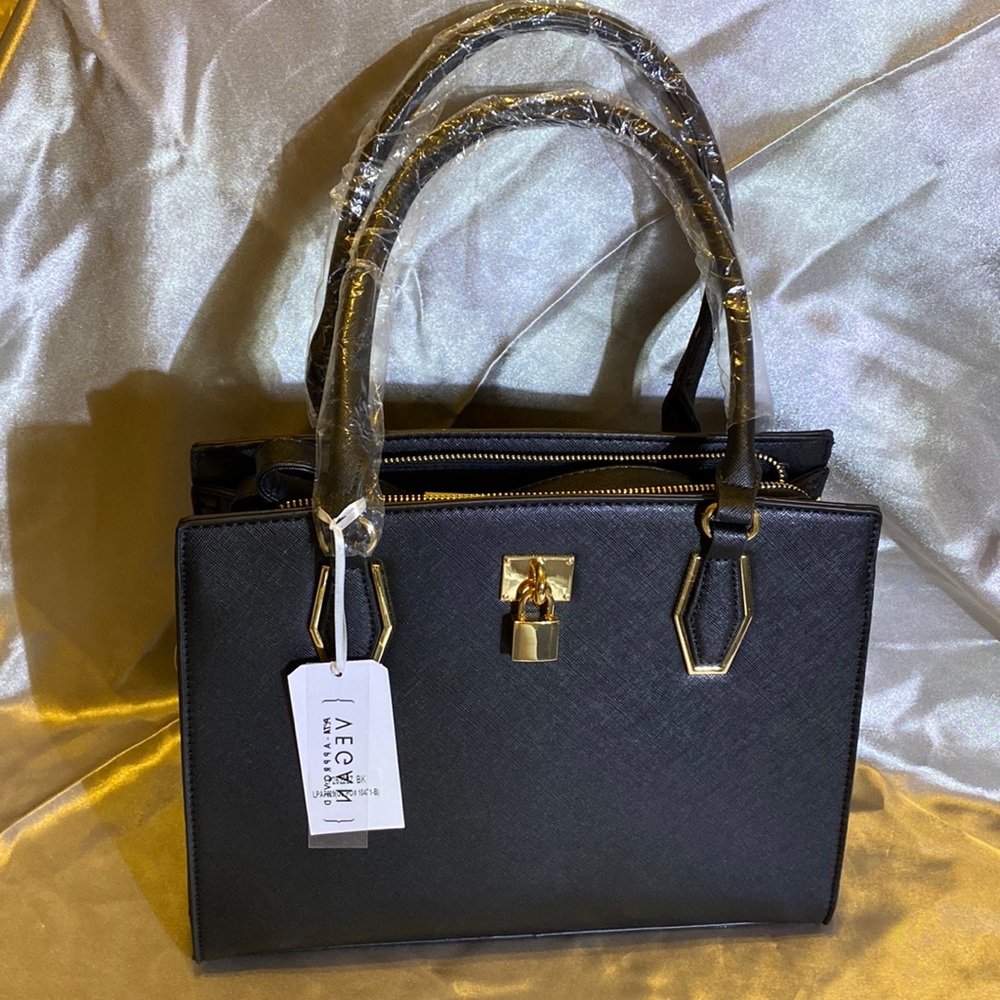 Park Ave Collection black bag with gold trim.